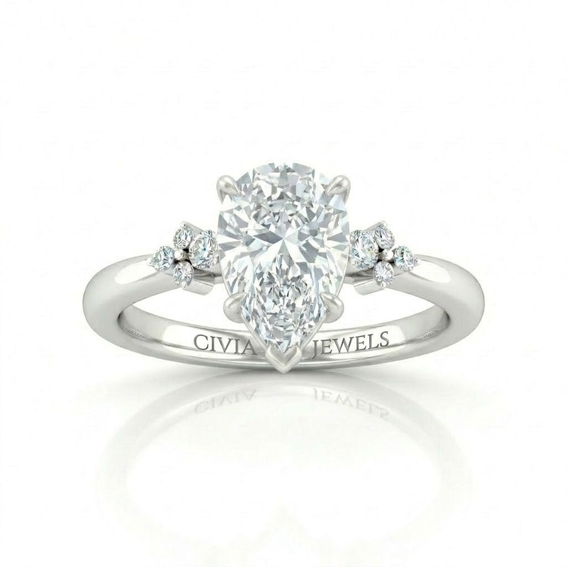 White Gold Pear Diamond Engagement Ring With Floral Cluster Side Design