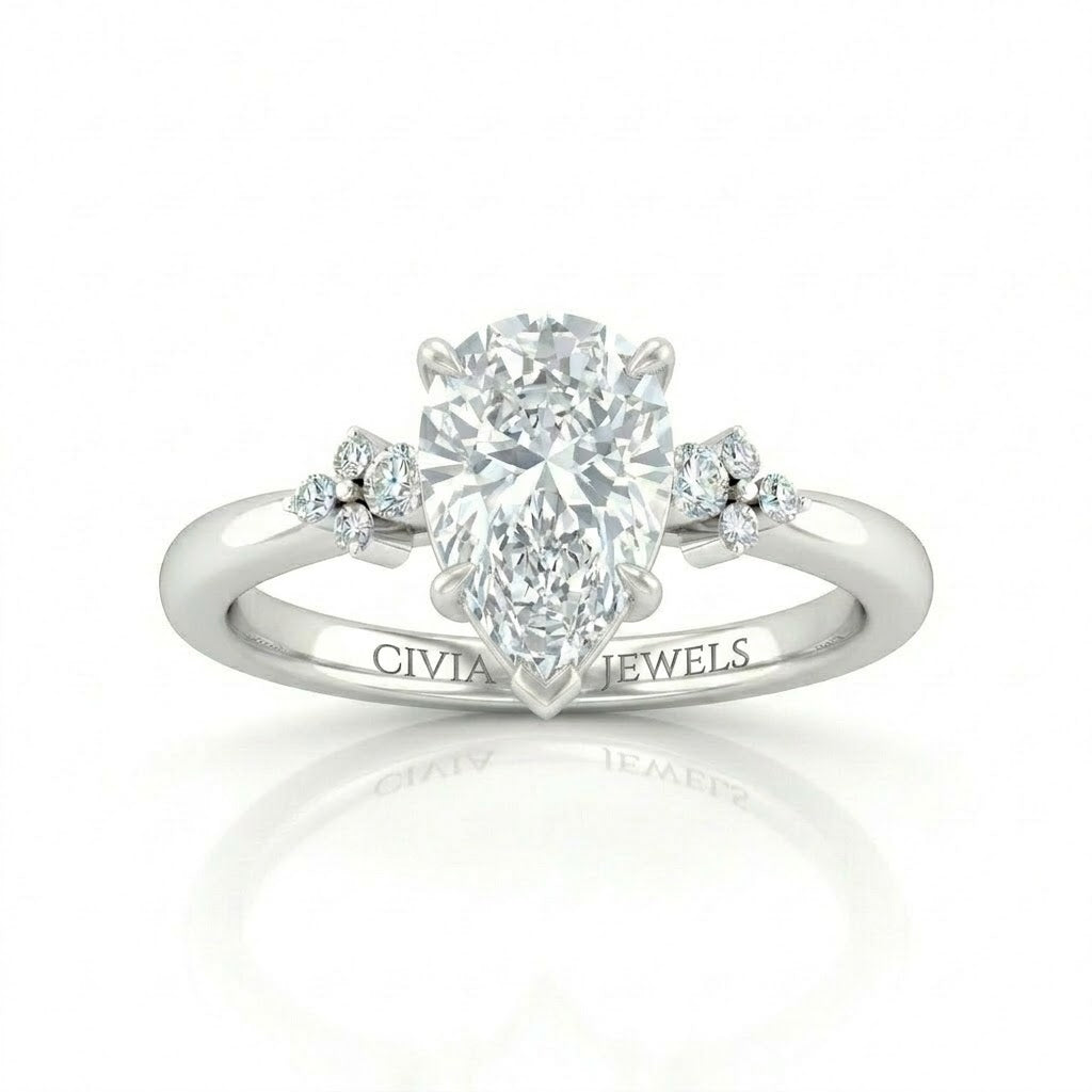 White Gold Pear Diamond Engagement Ring With Floral Cluster Side Design