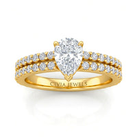 Yellow Gold Pear Diamond Engagement Ring With Split Pavé Band Design