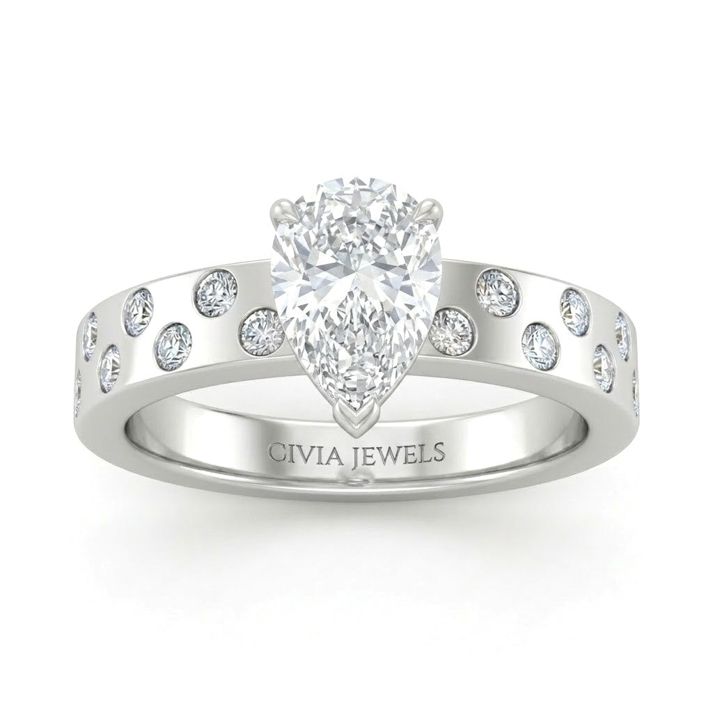 White Gold Pear Diamond Scattered Engagement Ring With Flush Set Accent Band
