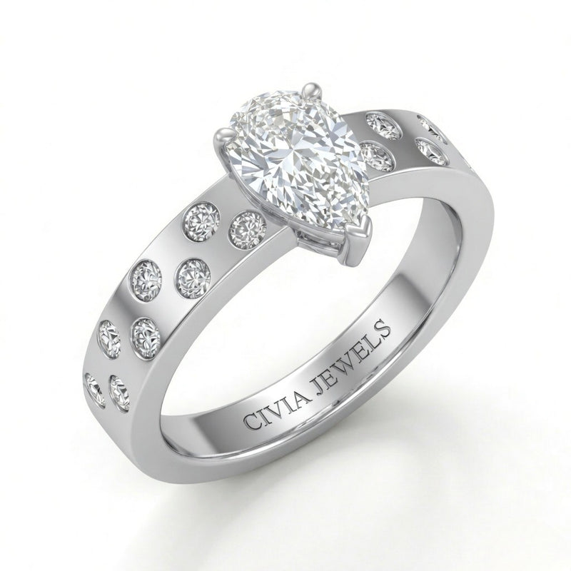 White Gold Pear Diamond Scattered Engagement Ring With Flush Set Accent Band