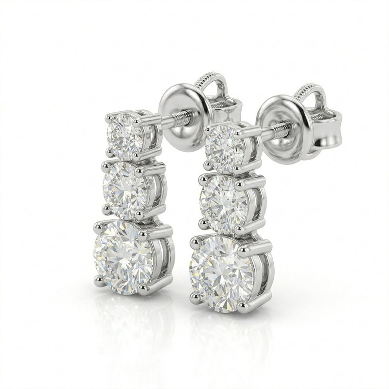 White Gold Round Graduated Three Stone Drop Earrings