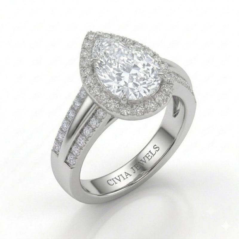 White Gold Pear Cut Diamond Halo Engagement Ring With Split Pave Shank