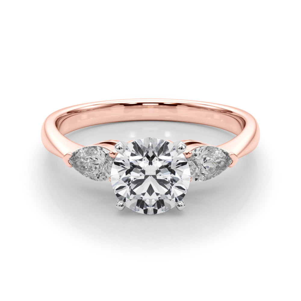 Rose gold Three-Stone Heart Diamond Ring with Pear Side Stones on a Platinum Band with Four-Prong Setting