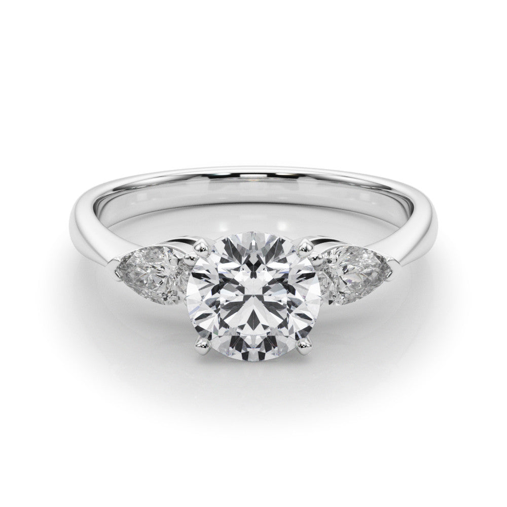 White gold Three-Stone Heart Diamond Ring with Pear Side Stones on a Platinum Band with Four-Prong Setting