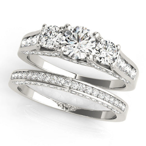 Silver Three-Stone Round Cut Diamond Ring with Channel-Set Band and Four-Prong Setting