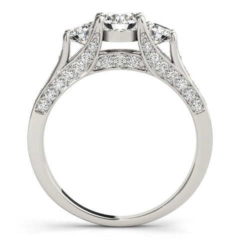 Platinum Three-Stone Round Cut Diamond Ring with Channel-Set Band and Four-Prong Setting