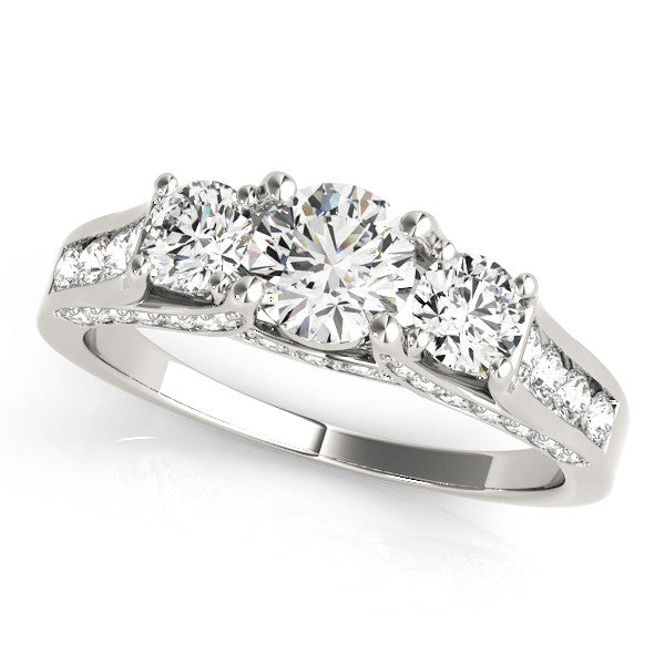 Platinum Three-Stone Round Cut Diamond Ring with Channel-Set Band and Four-Prong Setting