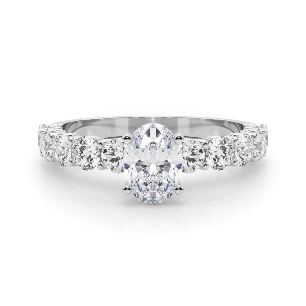 White gold Oval Diamond Prong Setting with Side Stones on a Pave Band