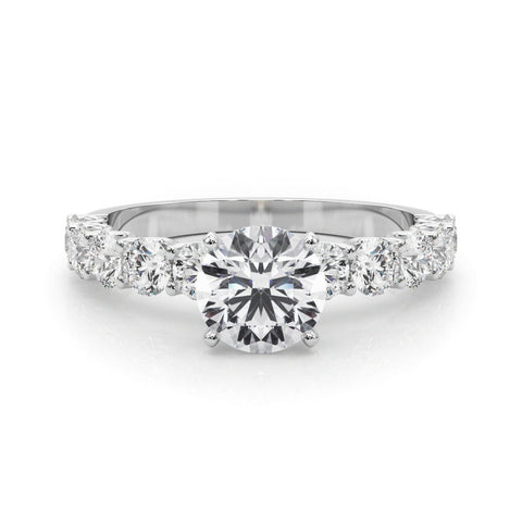 White gold Round Diamond Prong Setting with Side Stones on a Pave Band