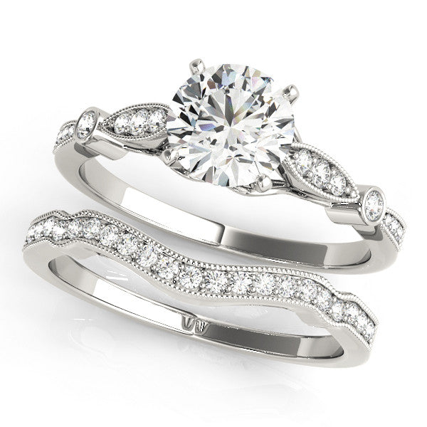 Platinum Round Cut Diamond with Milgrain Marquise and Bezel Accents on a Solitaire Band with Prong Setting