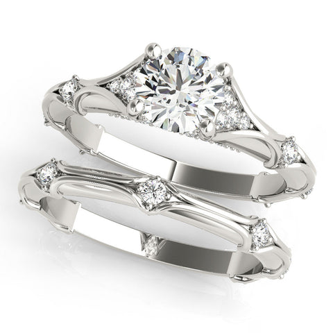 Platinum Round Cut Solitaire Engagement Ring with Pave Band and Four-Prong Setting