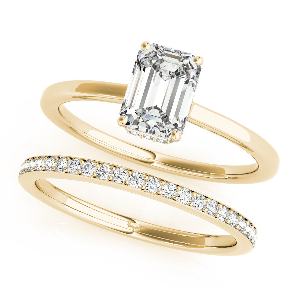 Yellow gold Marquise Cut Solitaire Engagement Ring with Four-Prong Setting on a Classic Band