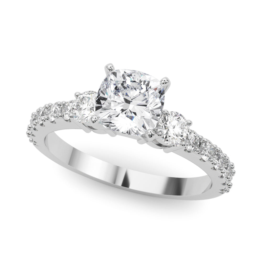 Platinum Cushion Cut Three-Stone Diamond Pavé Band with Prong Setting
