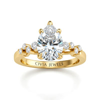 Yellow Gold Pear Cut Engagement Ring With Diamond Scatter Accent Shoulders And Classic Four-Prong Setting
