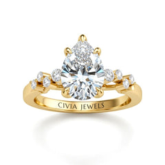 Yellow Gold Pear Cut Engagement Ring With Diamond Scatter Accent Shoulders And Classic Four-Prong Setting
