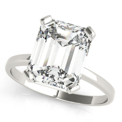 Silver Emerald Cut Solitaire Ring with Four-Prong Setting and Classic Band