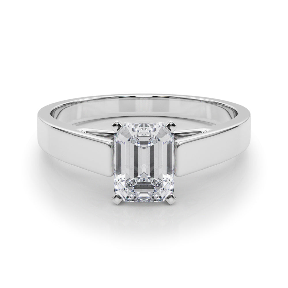 Silver Emerald Solitaire Engagement Ring with Four-Prong Setting and Tapered Band