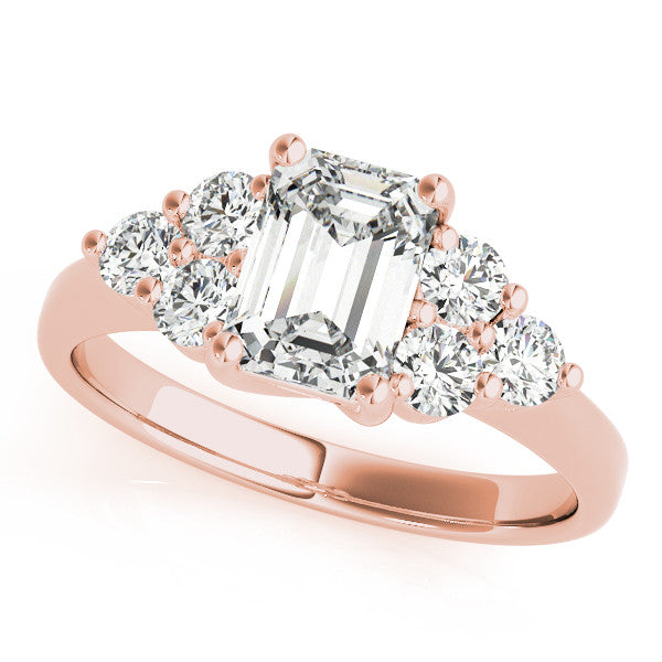 Rose gold Emerald Cut Diamond Cluster Ring with Round Accent Stones and Prong Setting on a Classic Band