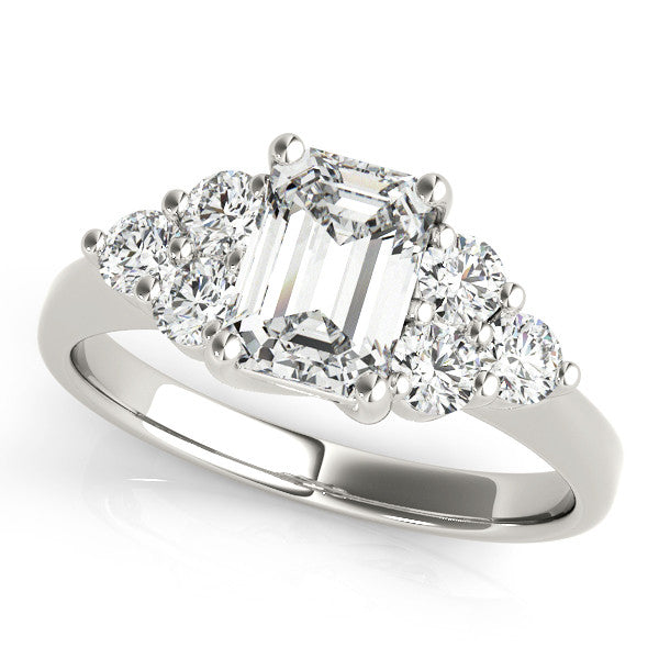 Silver Emerald Cut Diamond Cluster Ring with Round Accent Stones and Prong Setting on a Classic Band