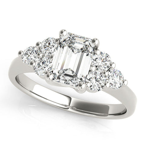 Platinum Emerald Cut Diamond Cluster Ring with Round Accent Stones and Prong Setting on a Classic Band