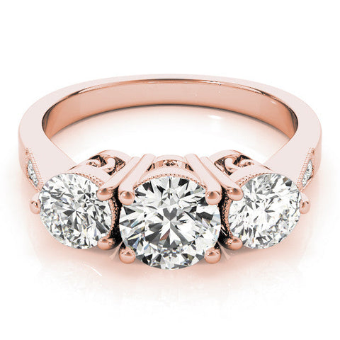Rose gold Three-Stone Oval Diamond Engagement Ring with Prong Setting on a Classic Band