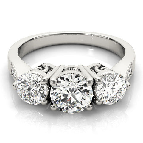 Platinum Three-Stone Cushion Diamond Engagement Ring with Prong Setting on a Classic Band