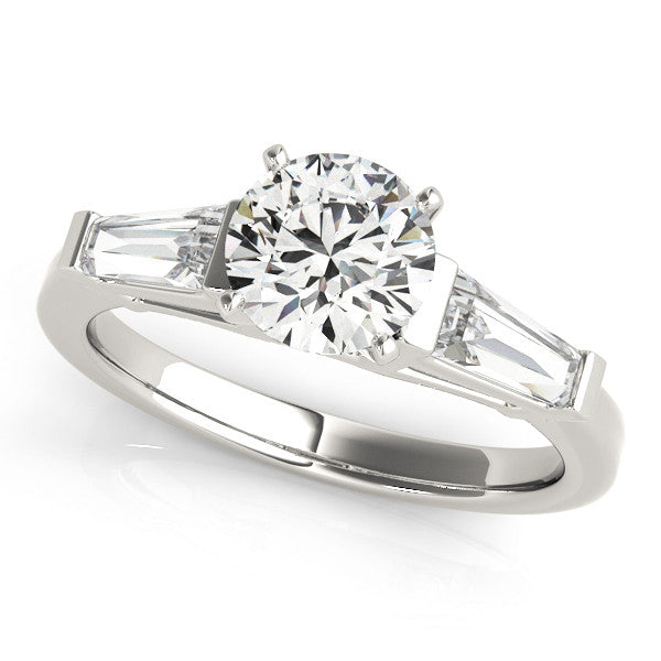 White gold Heart Cut Diamond Solitaire Ring with Tapered Baguette Accents and Four-Prong Setting