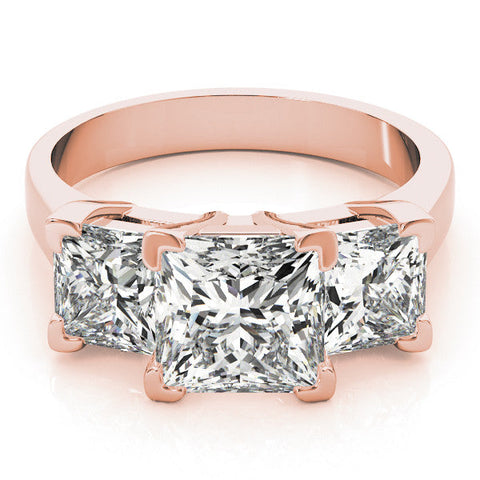 Rose gold Three-Stone Pear Cut Diamond Ring with Channel Set Band and Four-Prong Setting