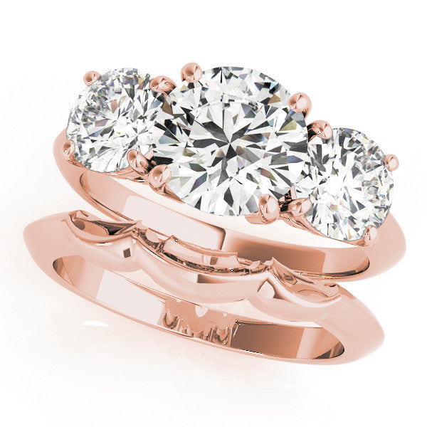 Rose gold Three-Stone Pear Cut Diamond Engagement Ring with Prong Setting on a White Gold Band
