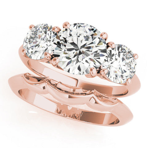 Rose gold Three-Stone Pear Cut Diamond Engagement Ring with Prong Setting on a White Gold Band