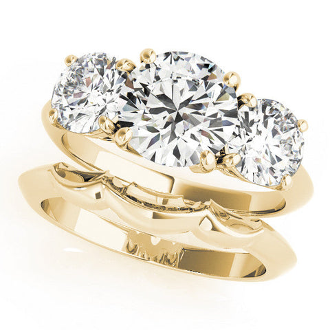 Yellow gold Three-Stone Pear Cut Diamond Engagement Ring with Prong Setting on a White Gold Band