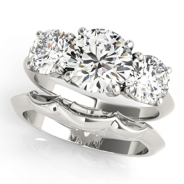 Silver Three-Stone Round Cut Diamond Engagement Ring with Prong Setting on a Silver Band