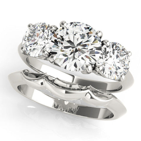 Platinum Three-Stone Heart Cut Diamond Engagement Ring with Prong Setting on a White Gold Band