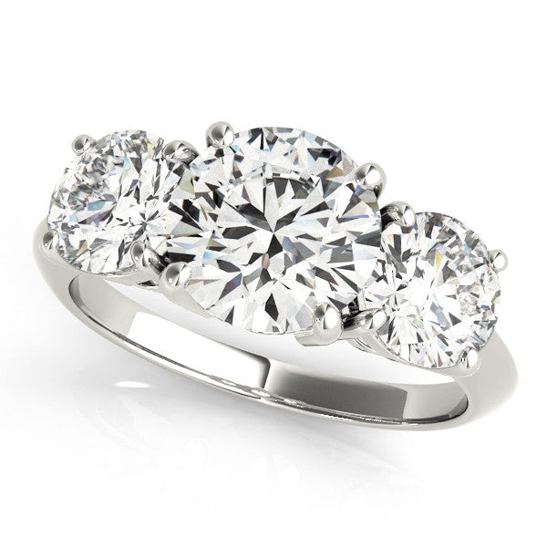 Platinum Three-Stone Marquise Cut Diamond Engagement Ring with Prong Setting on a White Gold Band
