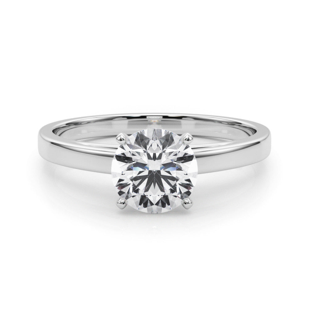 Platinum Round Solitaire Diamond Engagement Ring with Four-Prong Setting on a Classic Band