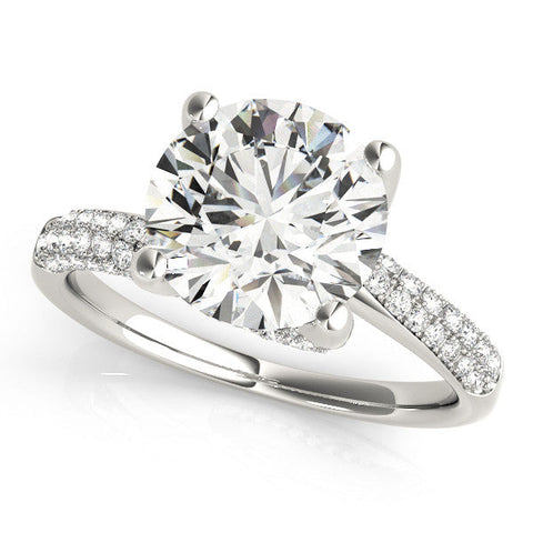 Platinum Round Cut Diamond Solitaire Engagement Ring with Pave Band and Four-Prong Setting