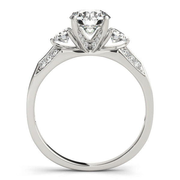 Platinum Round Brilliant Three-Stone Diamond Ring with Pavé Band and Four-Prong Setting