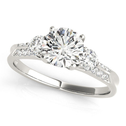 Platinum Round Brilliant Three-Stone Diamond Ring with Pavé Band and Four-Prong Setting