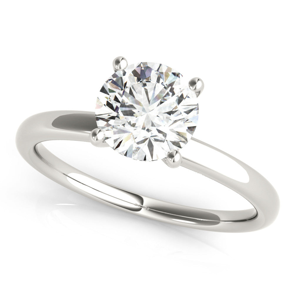 Silver Round Solitaire Diamond Ring with Four-Prong Setting and Classic Band