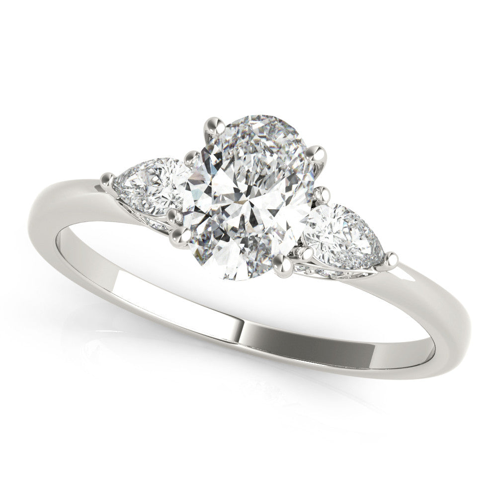 White gold Oval Cut Three-Stone Diamond Ring with Pear Side Stones on a Classic Solitaire Band with Prong Setting