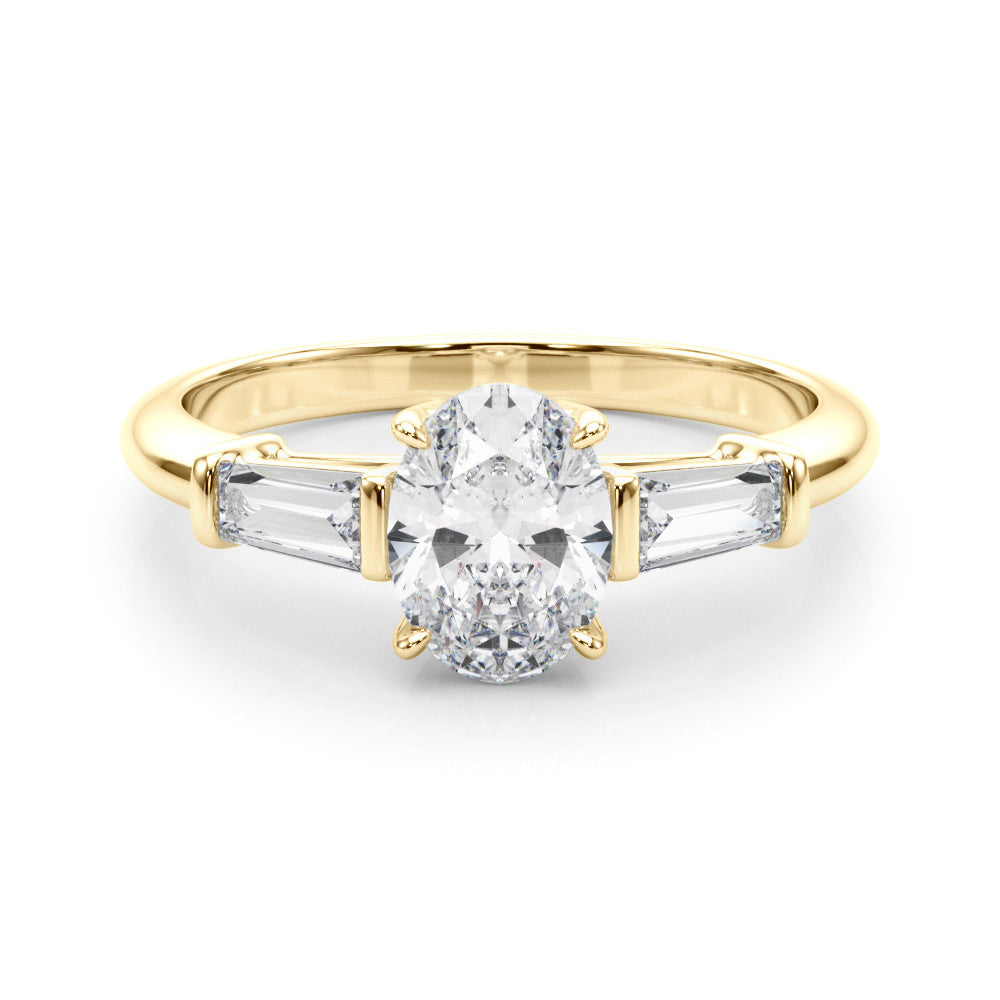 Yellow gold Oval Cut Diamond Ring with Tapered Baguette Side Stones on a Platinum Band with Four-Prong Setting