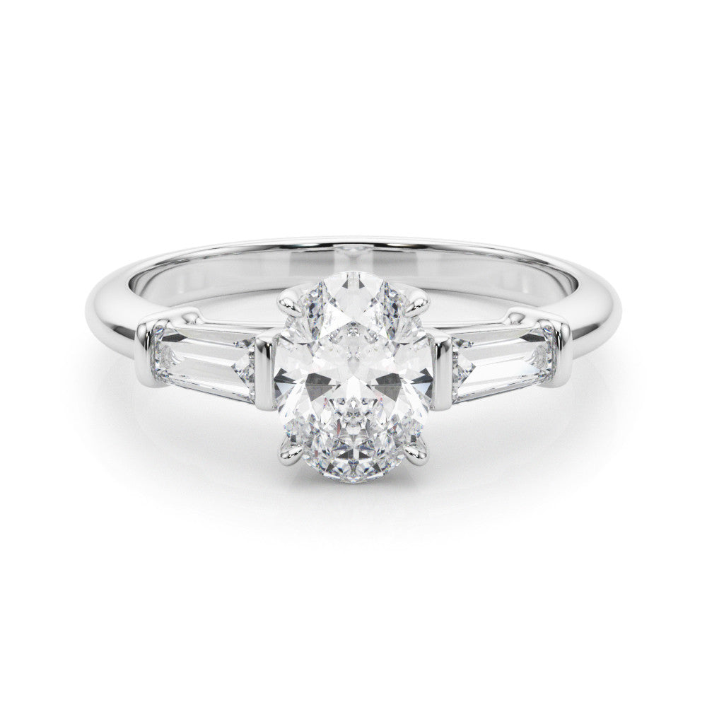 White gold Oval Cut Diamond Ring with Tapered Baguette Side Stones on a Platinum Band with Four-Prong Setting