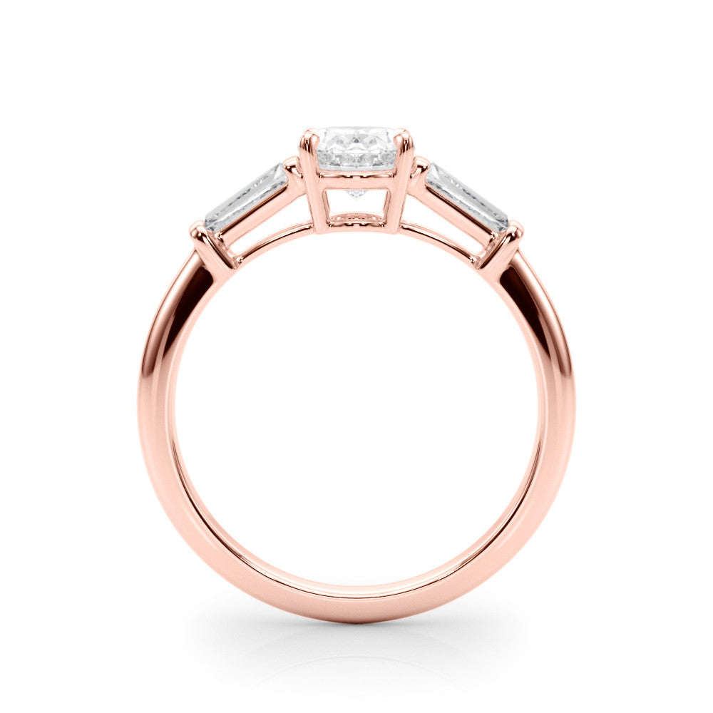 Rose gold Oval Cut Diamond Ring with Tapered Baguette Side Stones on a Platinum Band with Four-Prong Setting