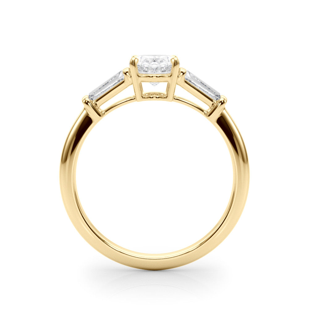 Yellow gold Oval Cut Diamond Ring with Tapered Baguette Side Stones on a Platinum Band with Four-Prong Setting