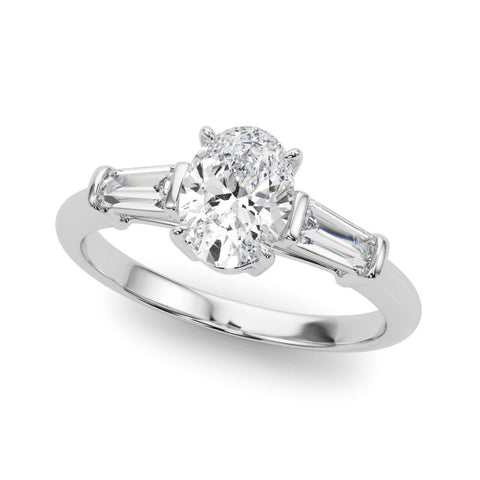 Platinum Oval Cut Diamond Ring with Tapered Baguette Side Stones on a Platinum Band with Four-Prong Setting