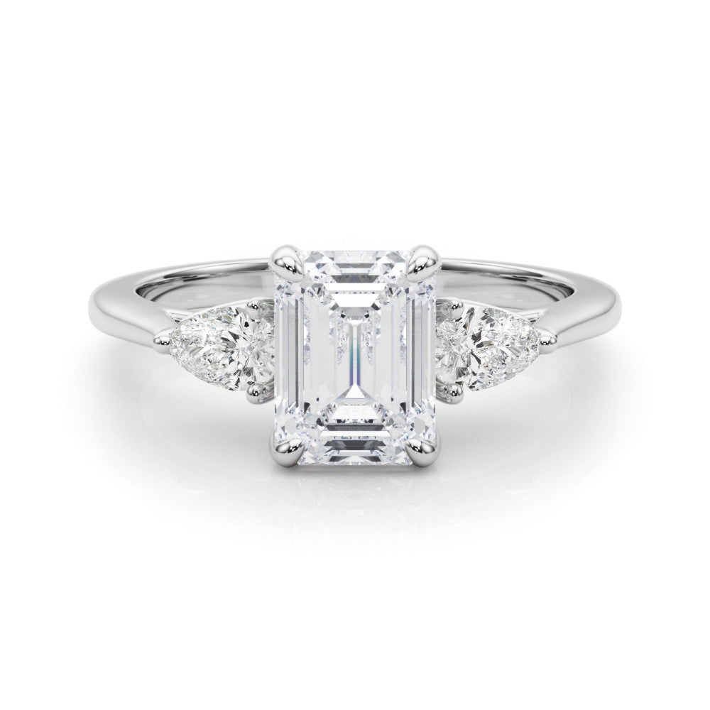 Platinum Three-Stone Emerald Cut Diamond Ring with Pear Side Stones on a Platinum Band and Four-Prong Setting