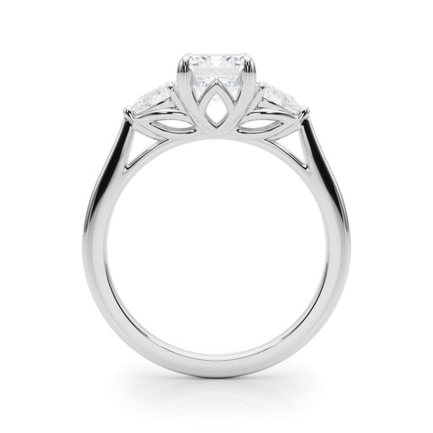 Platinum Three-Stone Emerald Cut Diamond Ring with Pear Side Stones on a Platinum Band and Four-Prong Setting