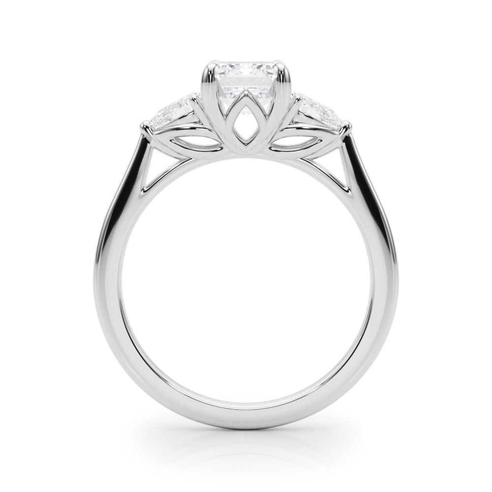 Platinum Three-Stone Emerald Cut Diamond Ring with Pear Side Stones on a Platinum Band and Four-Prong Setting