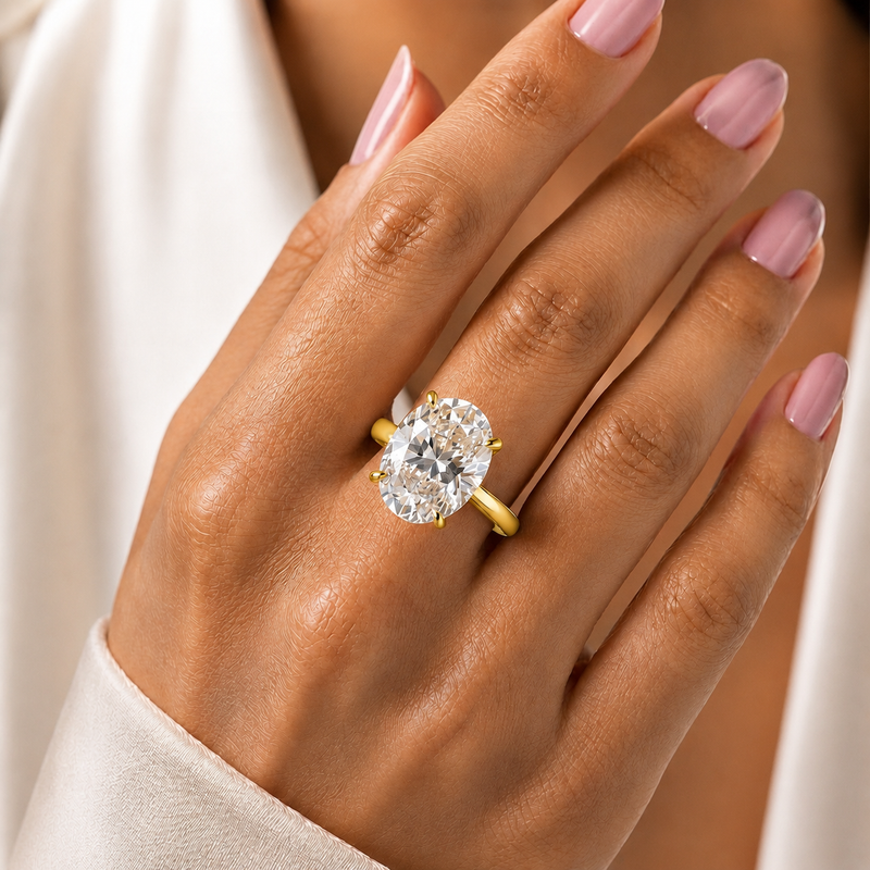 Yellow Gold Oval Cut Solitaire Engagement Ring with Sculpted Tapered Shank